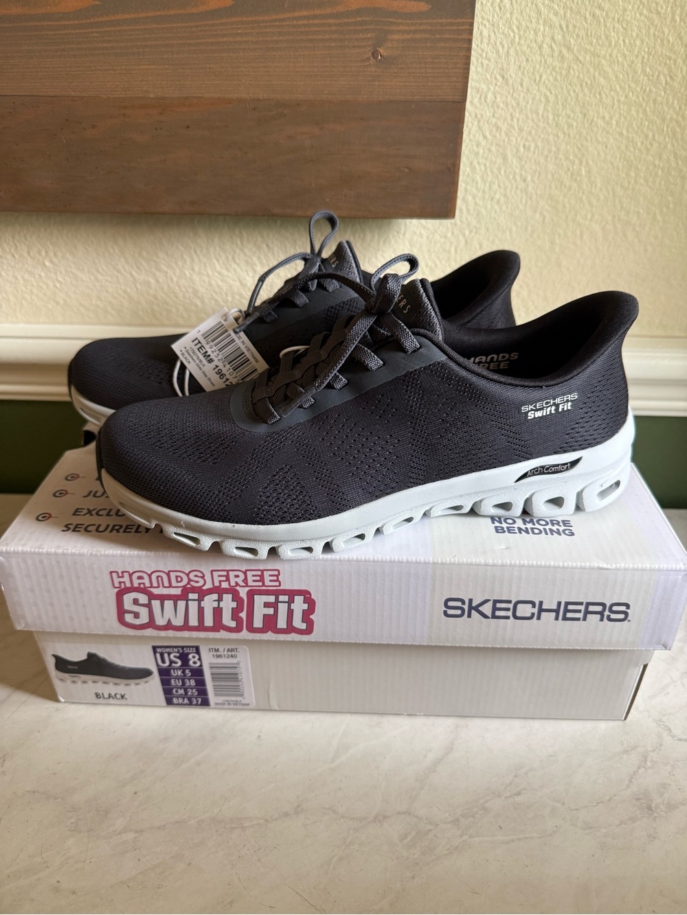 Skechers Women’s Swift Fit Black and White Slip-On Sneakers